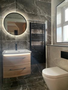 A stylish black and grey en suite